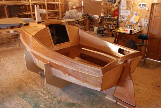 A shame to sully the varnished transom with a stinky outboard.